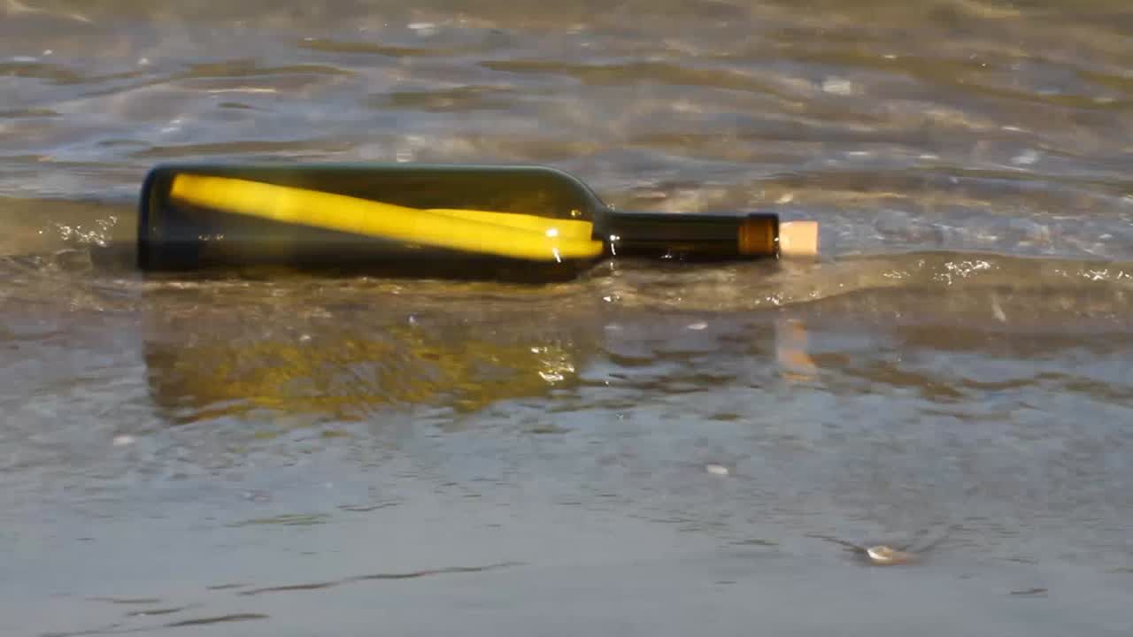 A message in a bottle floating on the water